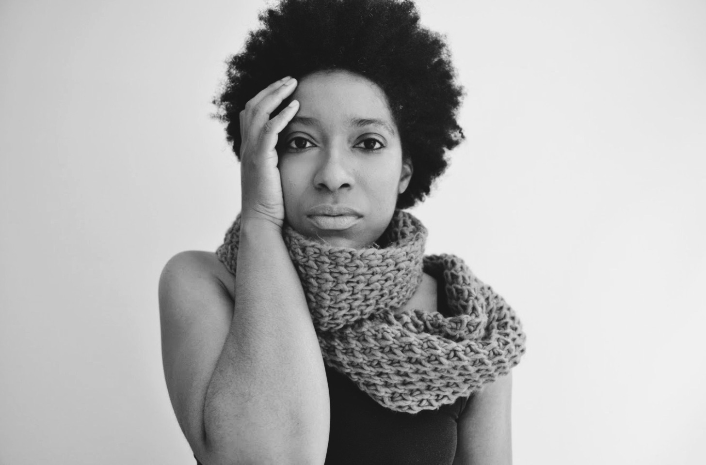 Black and white image of black woman in scarf black tank top natural self-portrait